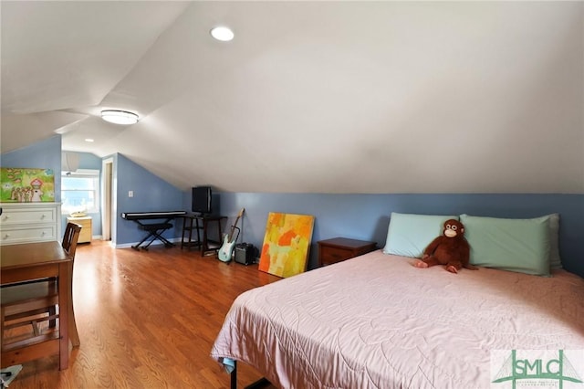 405 E 55th St, Savannah, GA 31405 - bedroom with lofted ceiling and wood finished floors