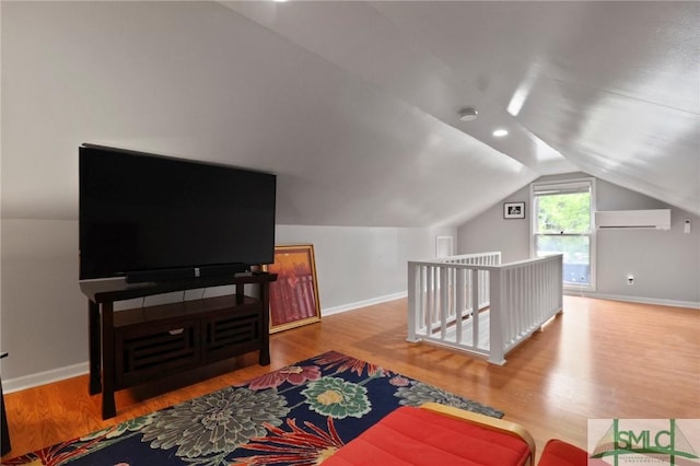 405 E 55th St, Savannah, GA 31405 - bonus room featuring a wall mounted AC, wood finished floors, vaulted ceiling, and baseboards