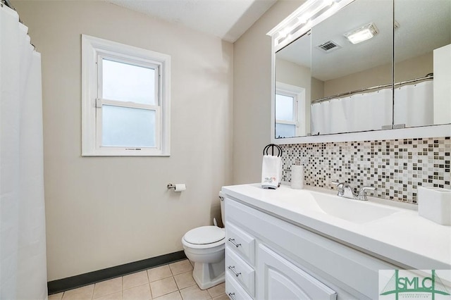 105 Pointe S Dr, Hinesville, GA 31313 - full bath with decorative backsplash, tile patterned flooring, toilet, vanity, and baseboards