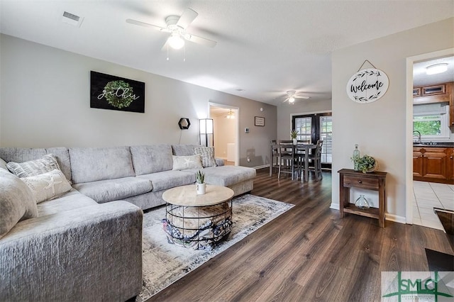 105 Pointe S Dr, Hinesville, GA 31313 - living area featuring a ceiling fan, wood finished floors, and baseboards