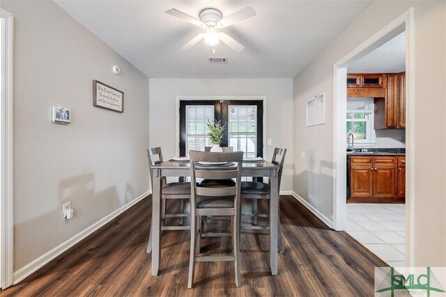 105 Pointe S Dr, Hinesville, GA 31313 - dining space with wood finished floors, a ceiling fan, and baseboards