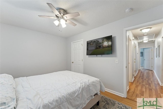 21 Carlisle Ln, Savannah, GA 31419 - bedroom featuring attic access, light wood finished floors, baseboards, and ceiling fan
