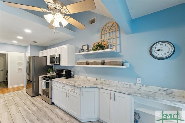 21 Carlisle Ln, Savannah, GA 31419 - kitchen with stainless steel appliances, open shelves, white cabinets, ceiling fan, and light stone countertops