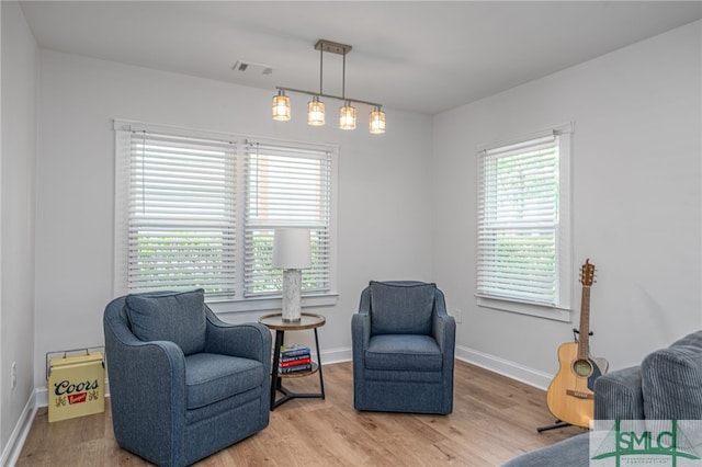 sitting room featuring wood finished floors and baseboards