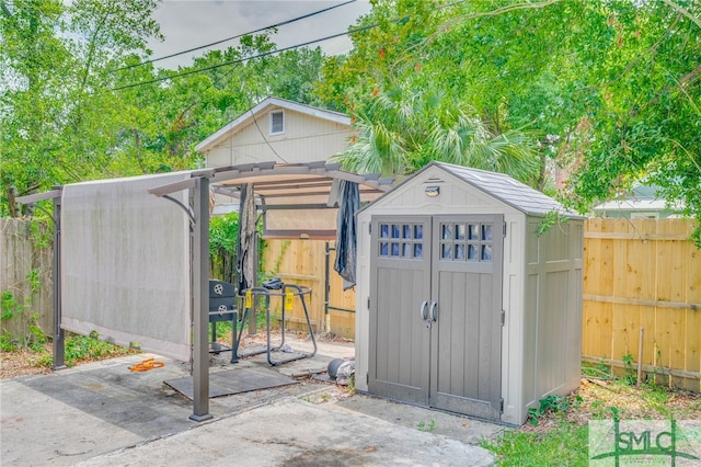 view of shed featuring a fenced backyard