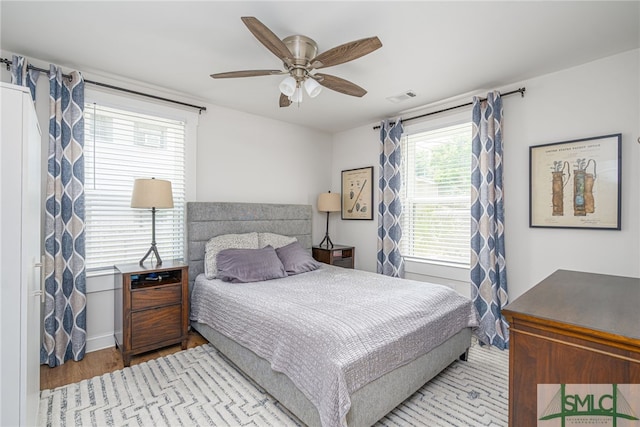 bedroom with wood finished floors and a ceiling fan