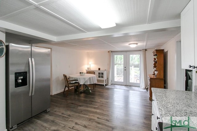 dining area with dark wood-style flooring and french doors