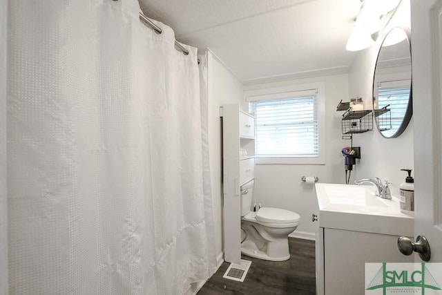full bathroom featuring wood finished floors, toilet, vanity, and baseboards