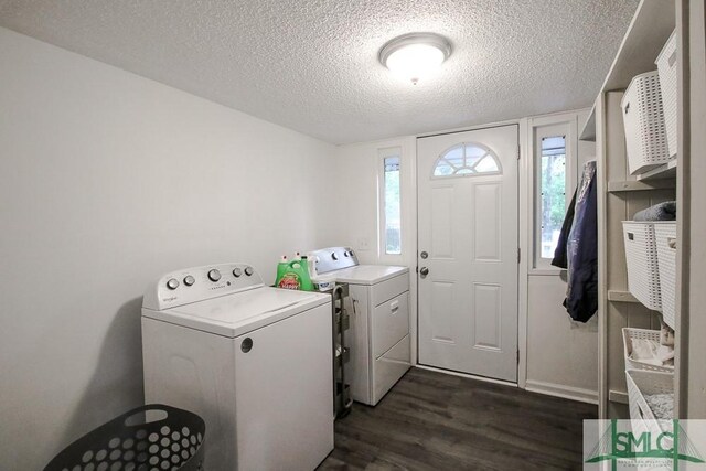 laundry area with dark wood-type flooring, a textured ceiling, and independent washer and dryer
