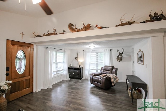 sitting room featuring dark wood-style floors, a ceiling fan, and baseboards