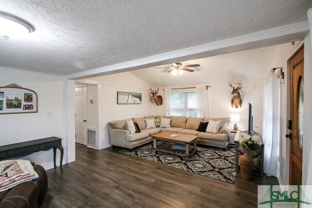 living area with a textured ceiling, wood finished floors, ceiling fan, ornamental molding, and lofted ceiling