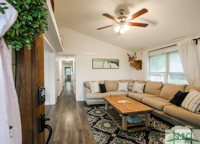 living room with ceiling fan, dark wood finished floors, vaulted ceiling, and plenty of natural light