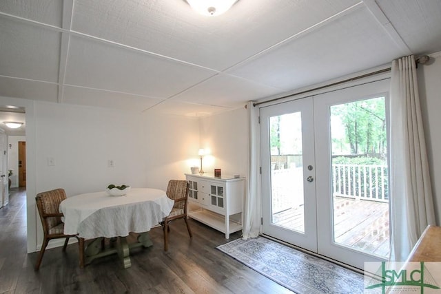 dining space featuring french doors and wood finished floors