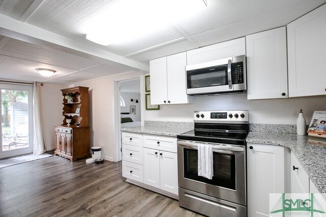 kitchen featuring stainless steel appliances, wood finished floors, white cabinets, and light stone countertops