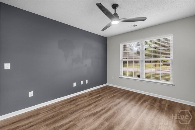 407 Middleton St, Pooler, GA 31322 - unfurnished room featuring wood finished floors, a textured ceiling, baseboards, and a ceiling fan
