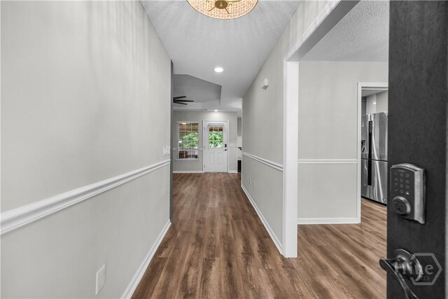 407 Middleton St, Pooler, GA 31322 - corridor featuring a textured ceiling, wood finished floors, and baseboards