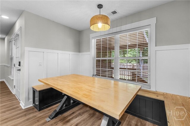 407 Middleton St, Pooler, GA 31322 - dining area featuring wood finished floors, wainscoting, and a decorative wall
