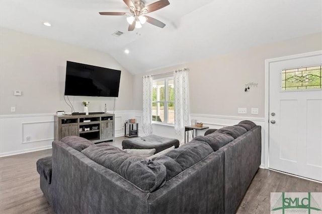 living room featuring ceiling fan, wainscoting, vaulted ceiling, wood finished floors, and recessed lighting