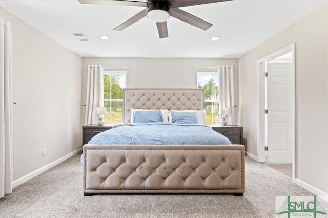 carpeted bedroom featuring baseboards, multiple windows, recessed lighting, and ceiling fan