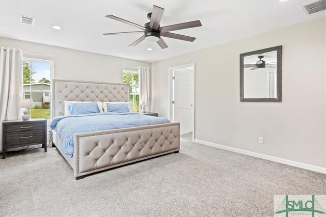 carpeted bedroom featuring multiple windows, baseboards, recessed lighting, and ceiling fan