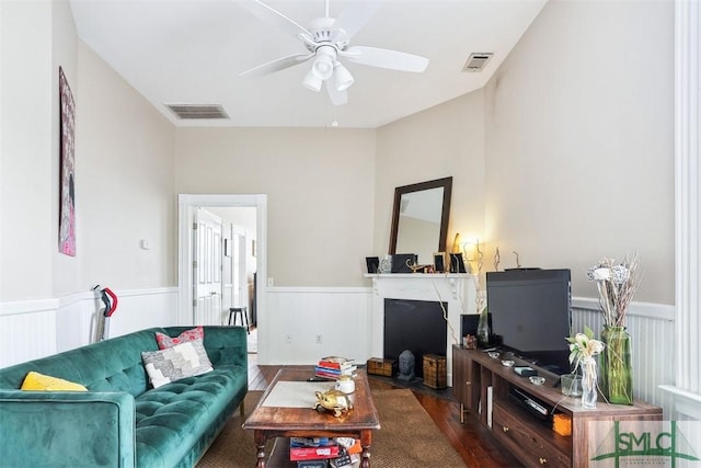 546548 E Huntingdon St, Savannah, GA 31401 - living area with a wainscoted wall, a ceiling fan, and wood finished floors