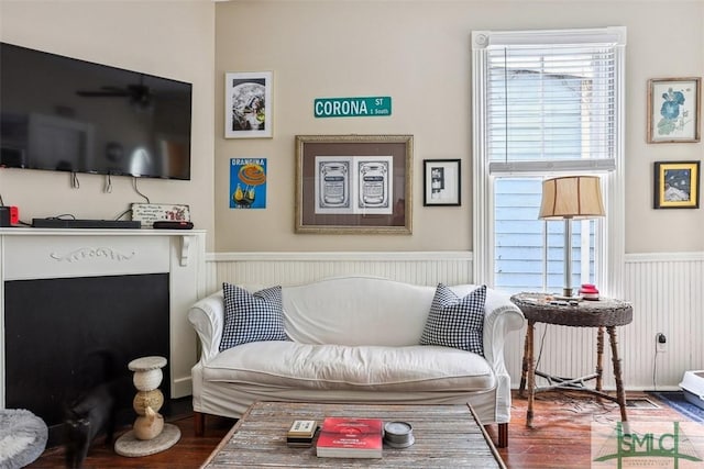 546548 E Huntingdon St, Savannah, GA 31401 - living area with wood finished floors and a wainscoted wall