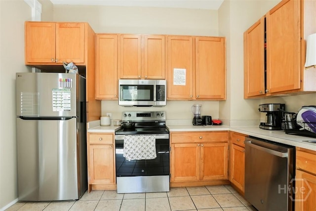 546548 E Huntingdon St, Savannah, GA 31401 - kitchen with appliances with stainless steel finishes, light countertops, and light tile patterned floors