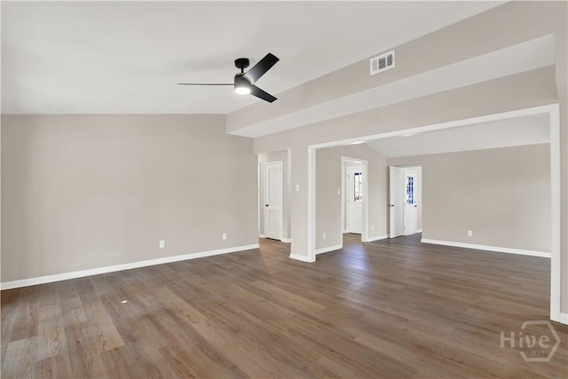 unfurnished living room with ceiling fan, dark wood-style flooring, baseboards, and lofted ceiling
