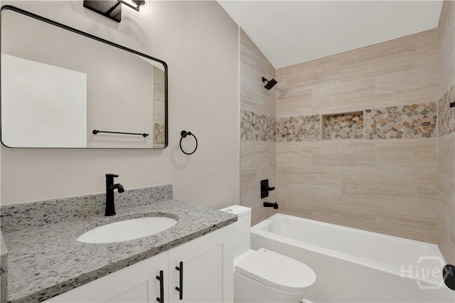 full bath featuring toilet, vanity, and shower / washtub combination