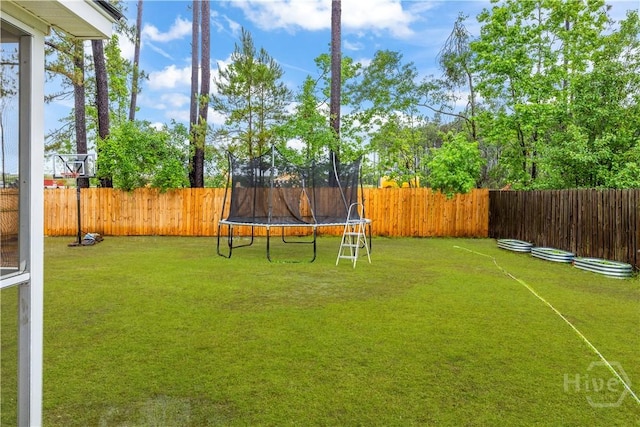 view of yard with a trampoline