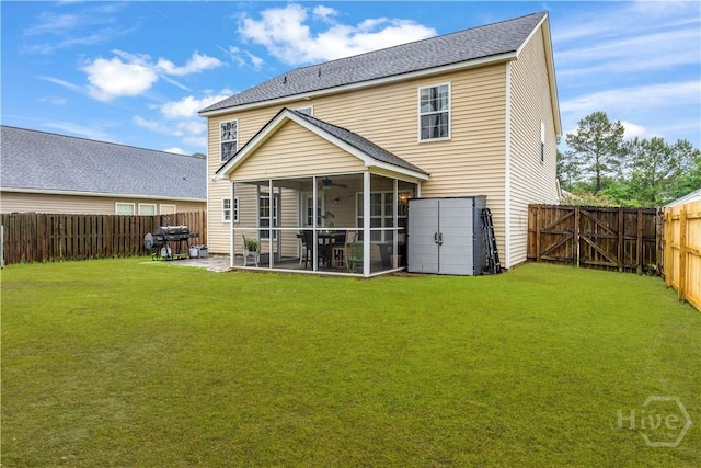 back of property featuring a sunroom, a ceiling fan, a patio, roof with shingles, and a storage unit