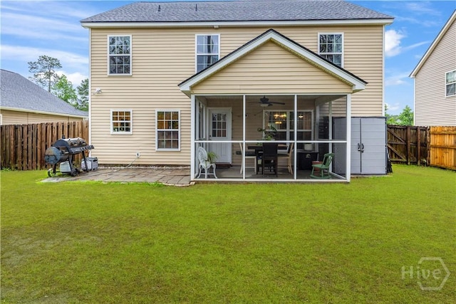 rear view of house with a sunroom, a ceiling fan, a patio, and a shingled roof
