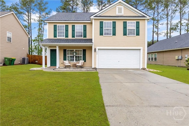 view of front of house featuring a garage, concrete driveway, covered porch, and a front lawn