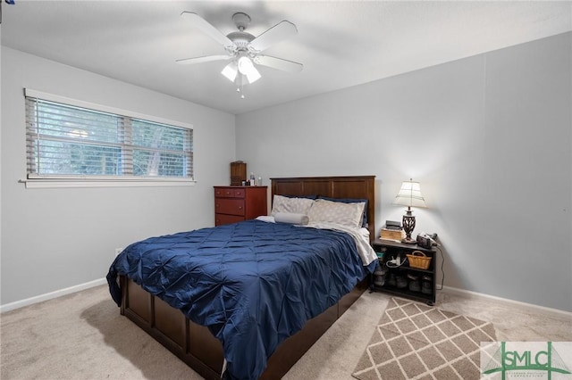 bedroom with carpet flooring, baseboards, and a ceiling fan