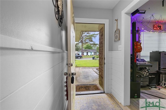 doorway to outside with an office area
