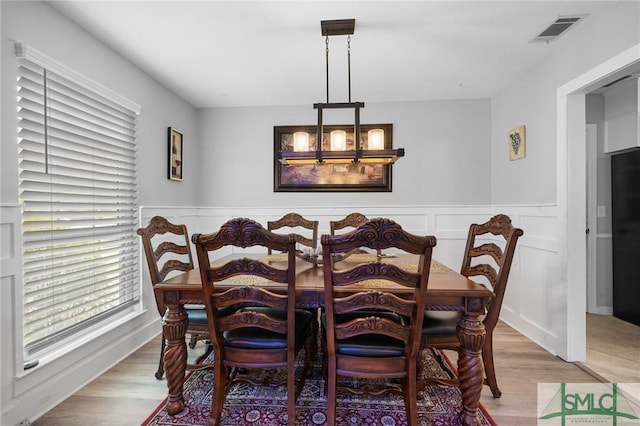 8 Chowning Dr, Savannah, GA 31419 - dining space featuring light wood-style floors and a wainscoted wall