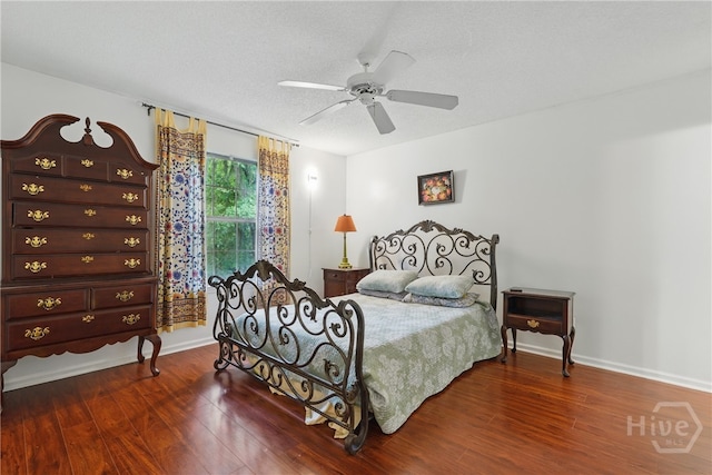 211 Edgewater Rd Unit 22, Savannah, GA 31406 - bedroom with wood finished floors, a textured ceiling, a ceiling fan, and baseboards