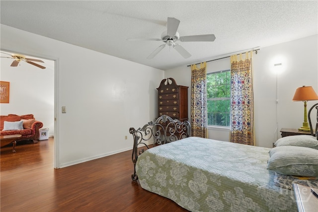 211 Edgewater Rd Unit 22, Savannah, GA 31406 - bedroom with wood finished floors, a textured ceiling, baseboards, and ceiling fan