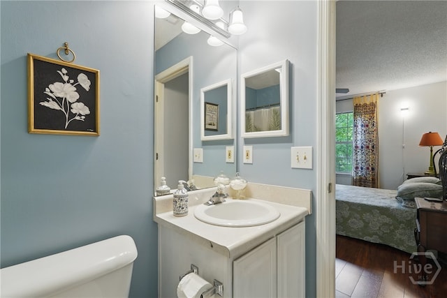 211 Edgewater Rd Unit 22, Savannah, GA 31406 - full bath featuring toilet, vanity, wood finished floors, connected bathroom, and a textured ceiling