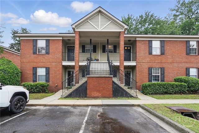 211 Edgewater Rd Unit 22, Savannah, GA 31406 - view of property with uncovered parking and stairs