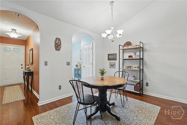 211 Edgewater Rd Unit 22, Savannah, GA 31406 - dining space featuring arched walkways, wood finished floors, baseboards, and vaulted ceiling