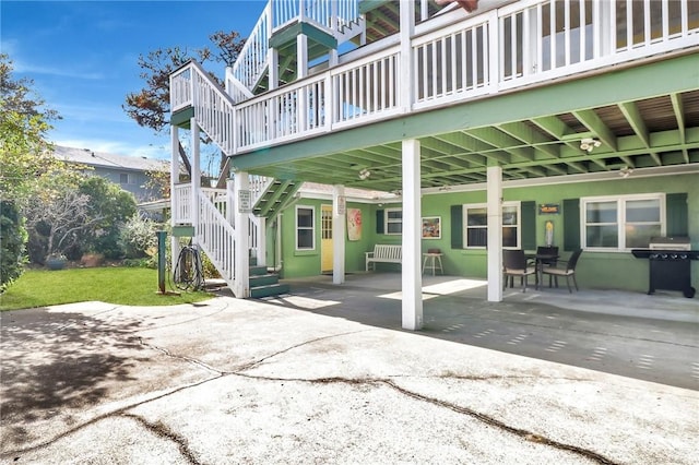 506 Butler Ave, Tybee Island, GA 31328 - view of patio / terrace featuring stairs and a grill