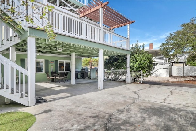 506 Butler Ave, Tybee Island, GA 31328 - view of patio with a pergola, grilling area, concrete driveway, and outdoor dining area