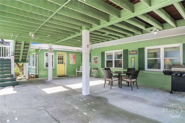 506 Butler Ave, Tybee Island, GA 31328 - view of patio / terrace with stairway, a grill, and outdoor dining area