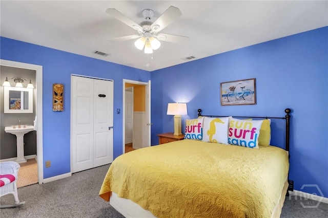 506 Butler Ave, Tybee Island, GA 31328 - bedroom with carpet flooring, baseboards, a closet, a ceiling fan, and a sink