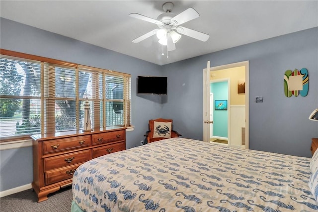 506 Butler Ave, Tybee Island, GA 31328 - bedroom with multiple windows, dark carpet, and baseboards