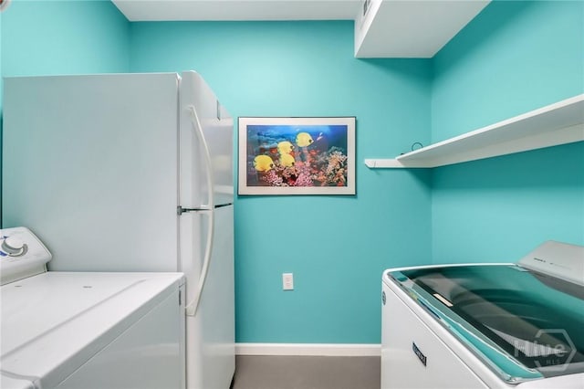 506 Butler Ave, Tybee Island, GA 31328 - clothes washing area featuring washer and clothes dryer and baseboards