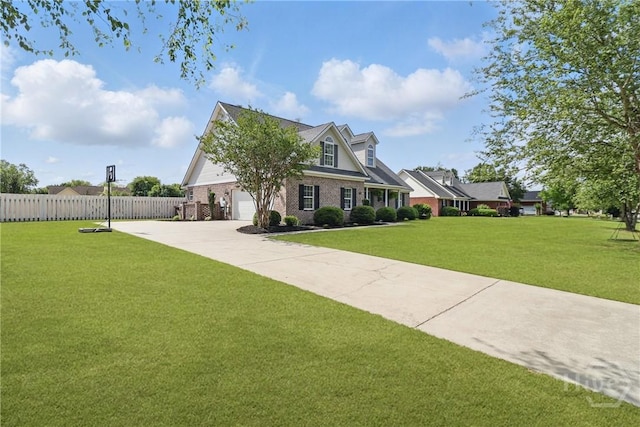 509 Braves Field Dr, Guyton, GA 31312 - cape cod-style house featuring concrete driveway and brick siding