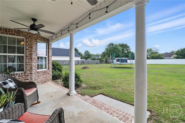 509 Braves Field Dr, Guyton, GA 31312 - view of patio featuring a trampoline, a ceiling fan, and an outdoor fire pit