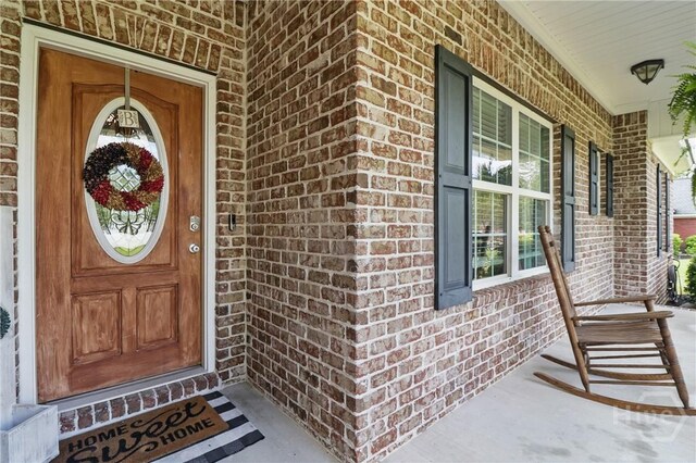 509 Braves Field Dr, Guyton, GA 31312 - entrance to property featuring brick siding and a porch